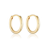 Gold Linda Tahija Max Huggie Earrings with sleek, minimalist design, close-up view of the stylish earrings on a white background.
