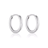 Linda Tahija Max Huggie Earrings in sterling silver, close-up of sleek, minimalist hoop earrings for everyday wear.