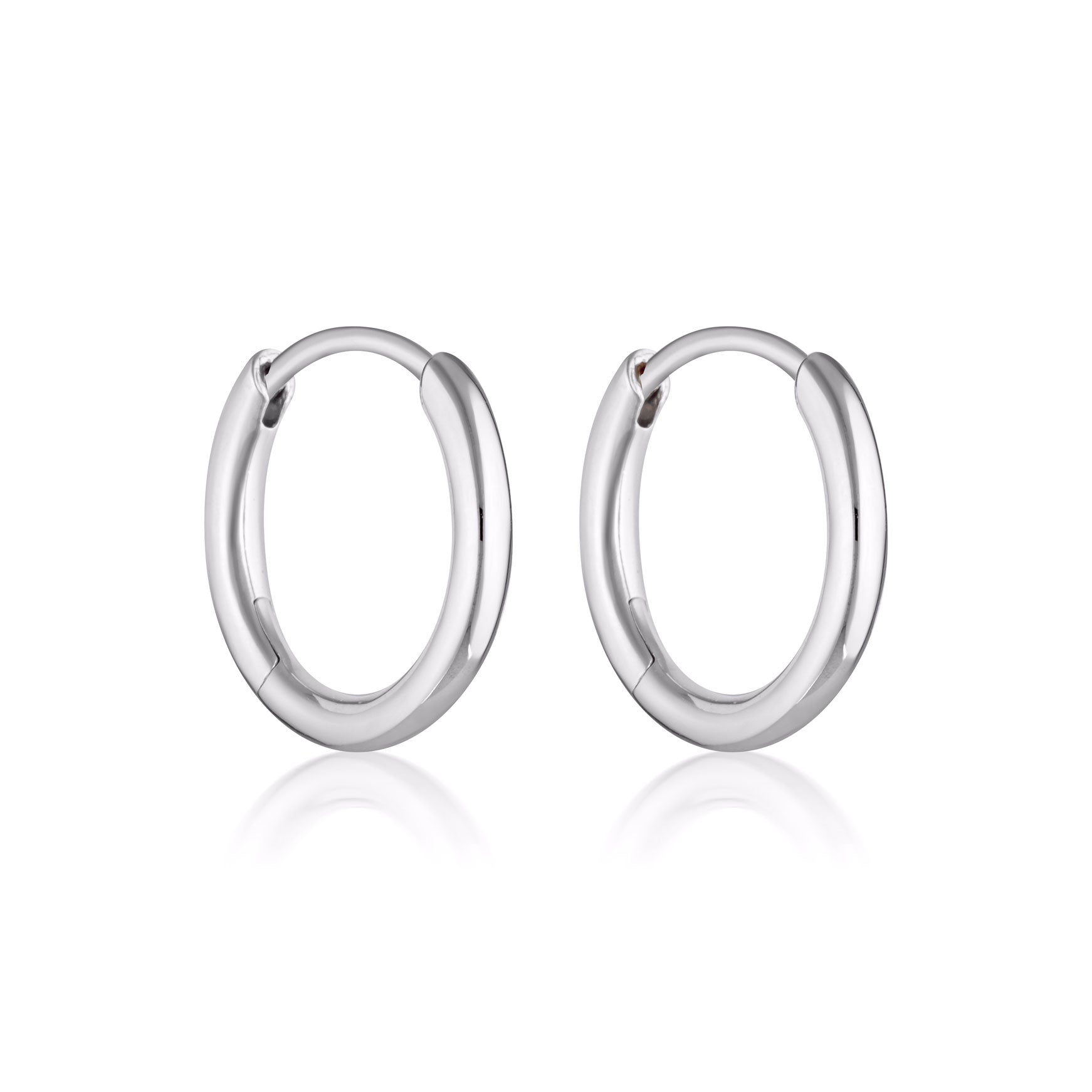 Linda Tahija Max Huggie Earrings in sterling silver, close-up of sleek, minimalist hoop earrings for everyday wear.