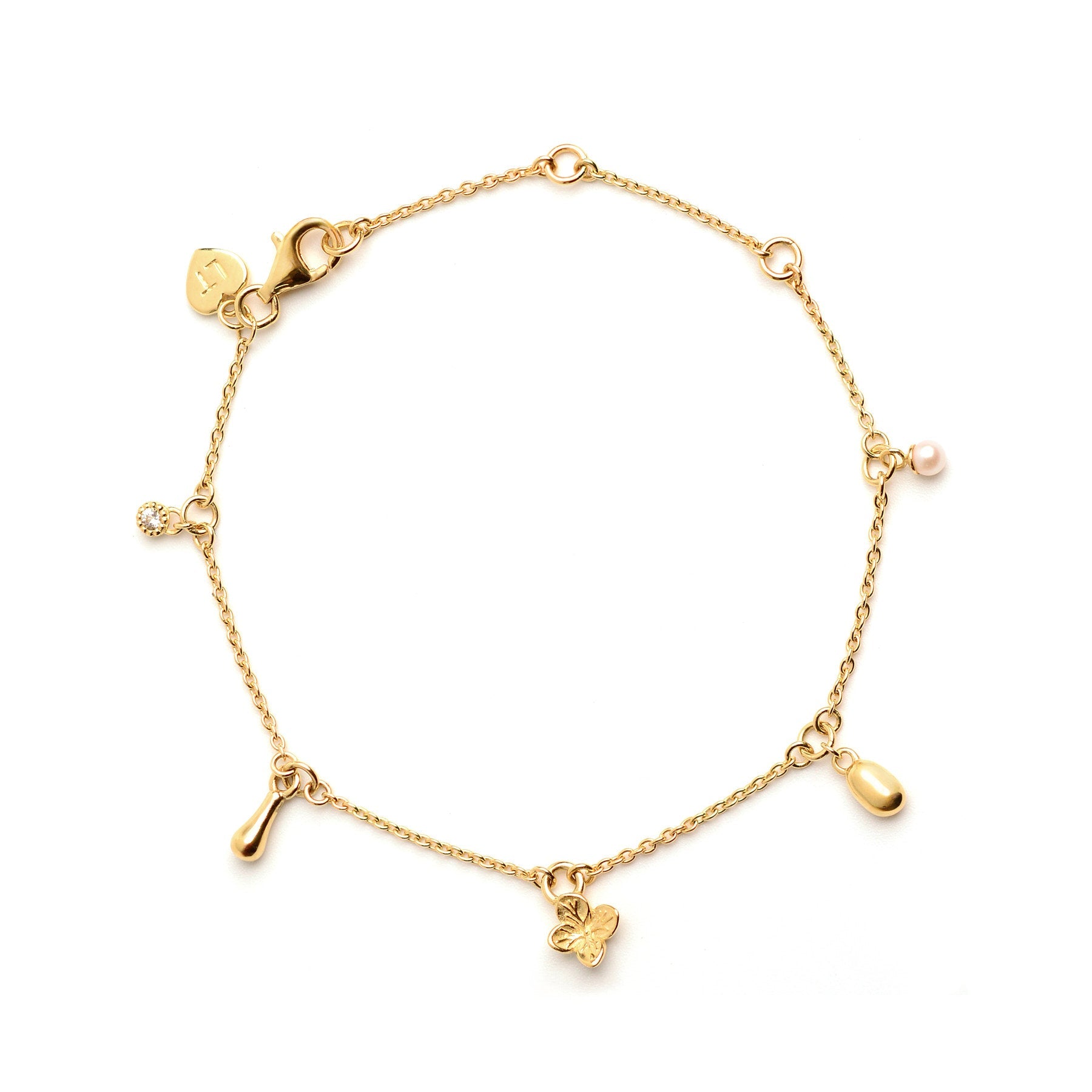 Linda Tahija Memento charm bracelet with 18k gold vermeil, featuring various charms on a delicate bracelet chain.