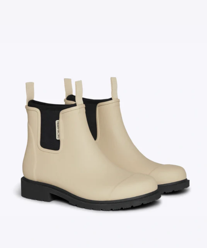 Merry People Bobbi Gumboot Sand shoes featuring durable rubber soles and stylish sand-colored waterproof design.