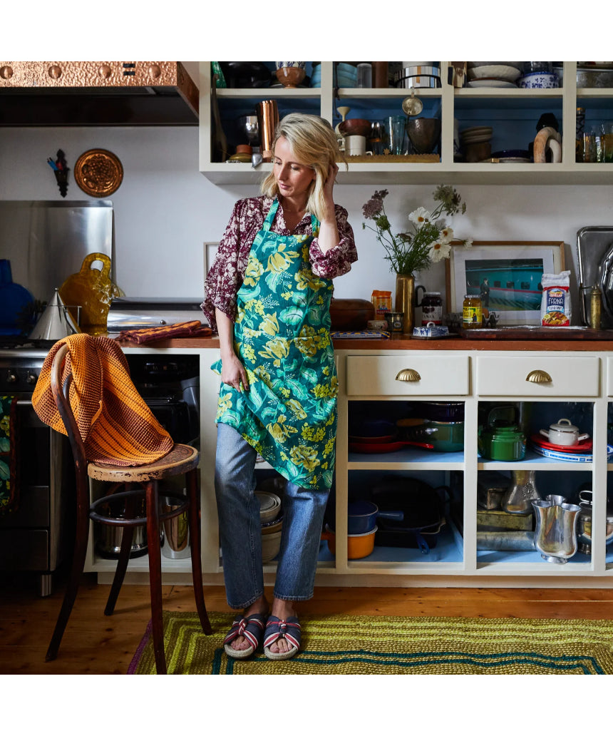 Sage x Clare Margot linen apron with adjustable ties and front pockets, featuring a stylish floral pattern.