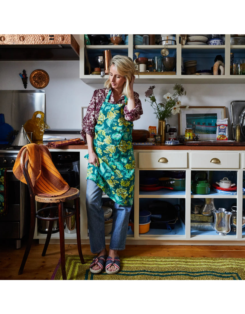 Sage x Clare Margot linen apron with adjustable ties and front pockets, featuring a stylish floral pattern.
