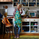 Sage x Clare Margot linen apron with adjustable ties and front pockets, featuring a stylish floral pattern.