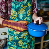 Sage x Clare Margot linen apron with adjustable neck strap and front pockets, featuring a stylish floral pattern.