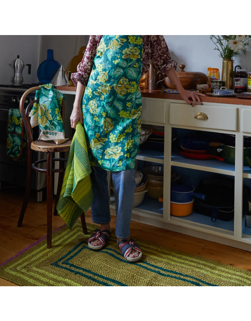 Sage x Clare Margot linen apron with waist ties and front pocket, featuring a stylish, lightweight design for cooking or baking.