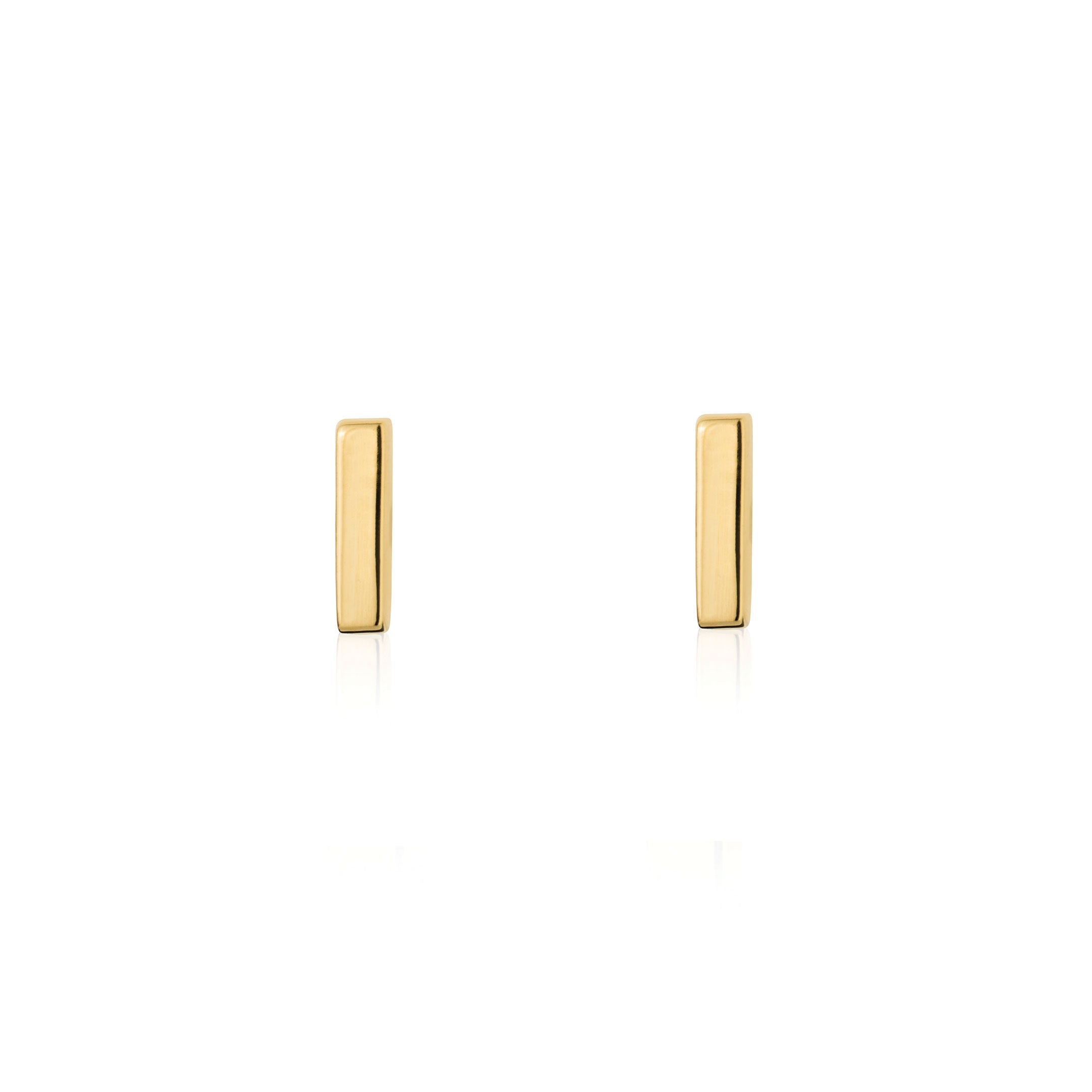 Gold mini bar stud earrings by Linda Tahija, small rectangular metal studs with a sleek, minimalist design.