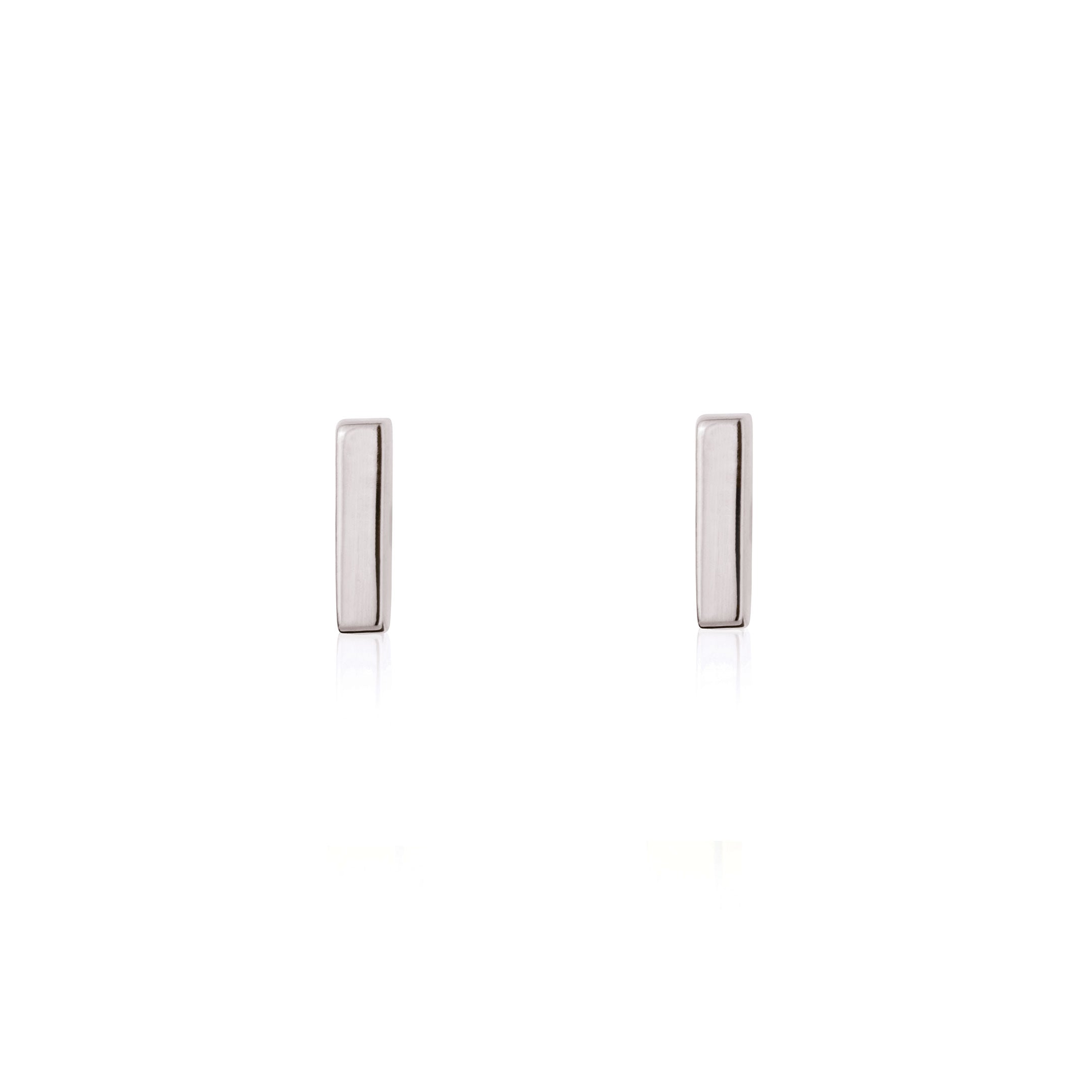 Linda Tahija mini bar stud earrings in sterling silver, close-up of sleek, minimalist jewelry design.
