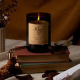 Mojo Candle Co. Autumn Lumiere limited edition candle with warm, autumn-inspired wax and decorative label.