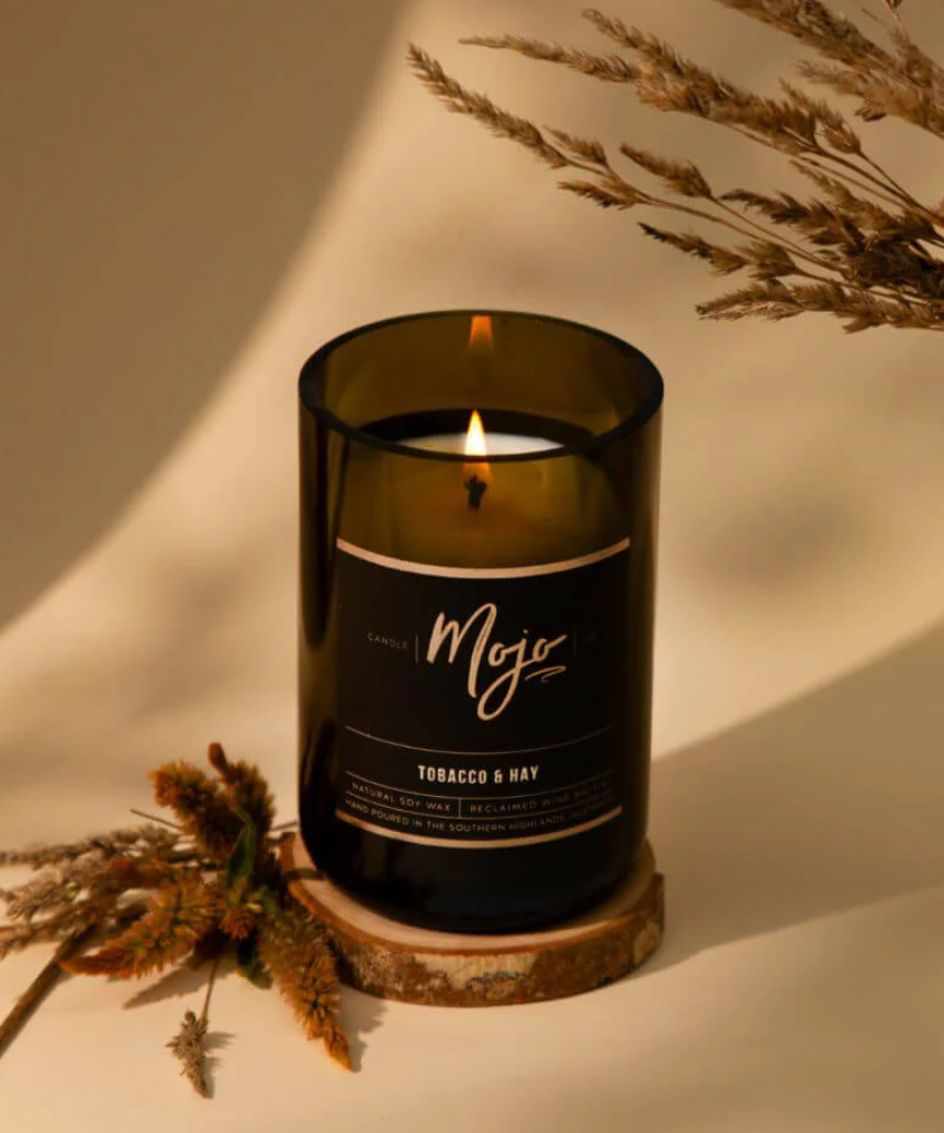 Mojo Candle Co. Tobacco & Hay Black Label candle with a sleek black container and rustic label design.