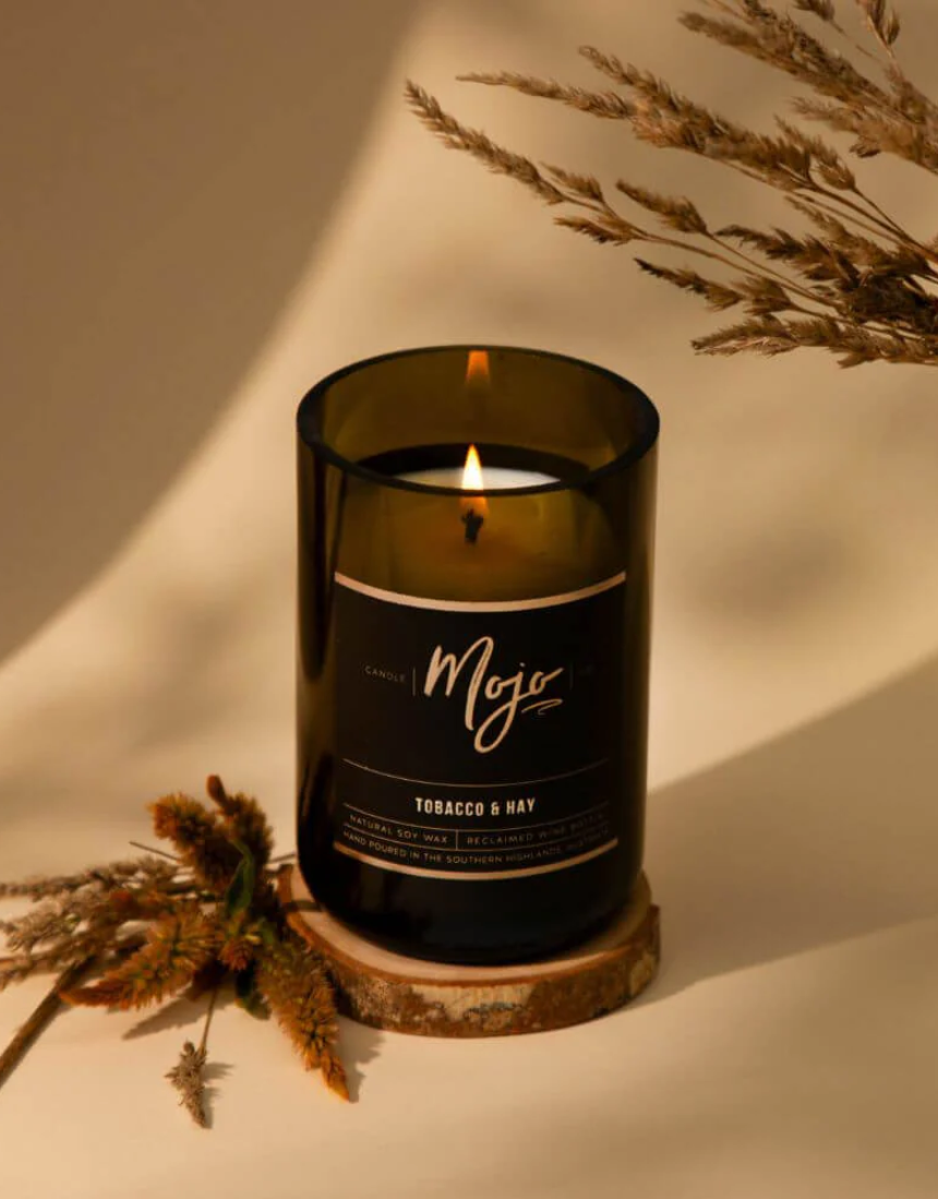 Mojo Candle Co. Tobacco & Hay Black Label candle with a sleek black container and rustic label design.