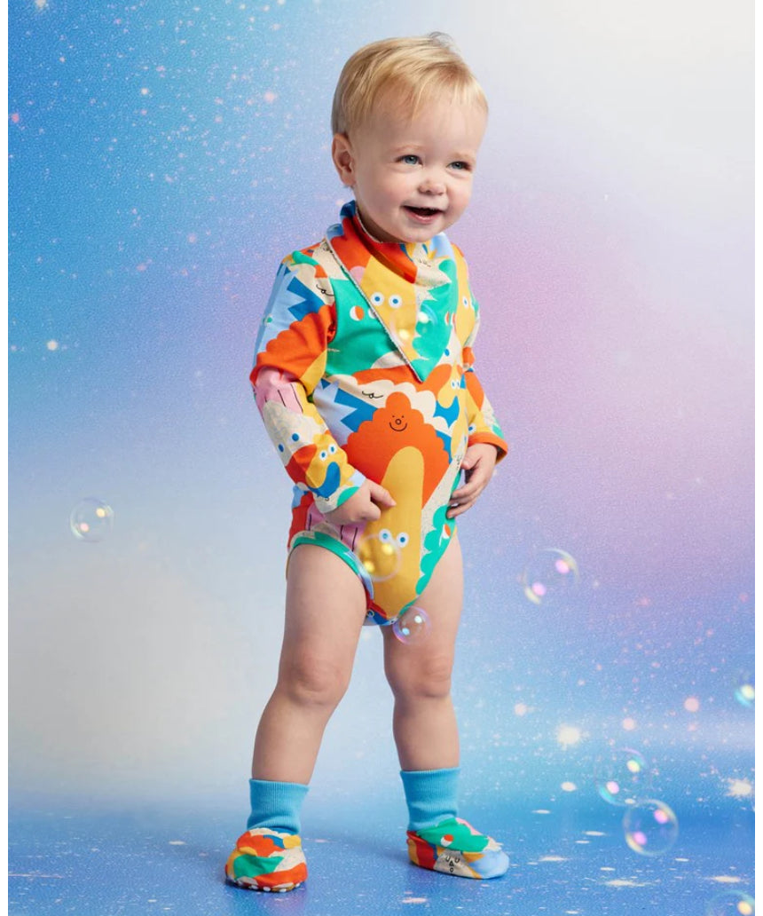 Halcyon Nights Mount Wiggly baby booties with colorful Wiggly character design, part of baby clothing set for infants.