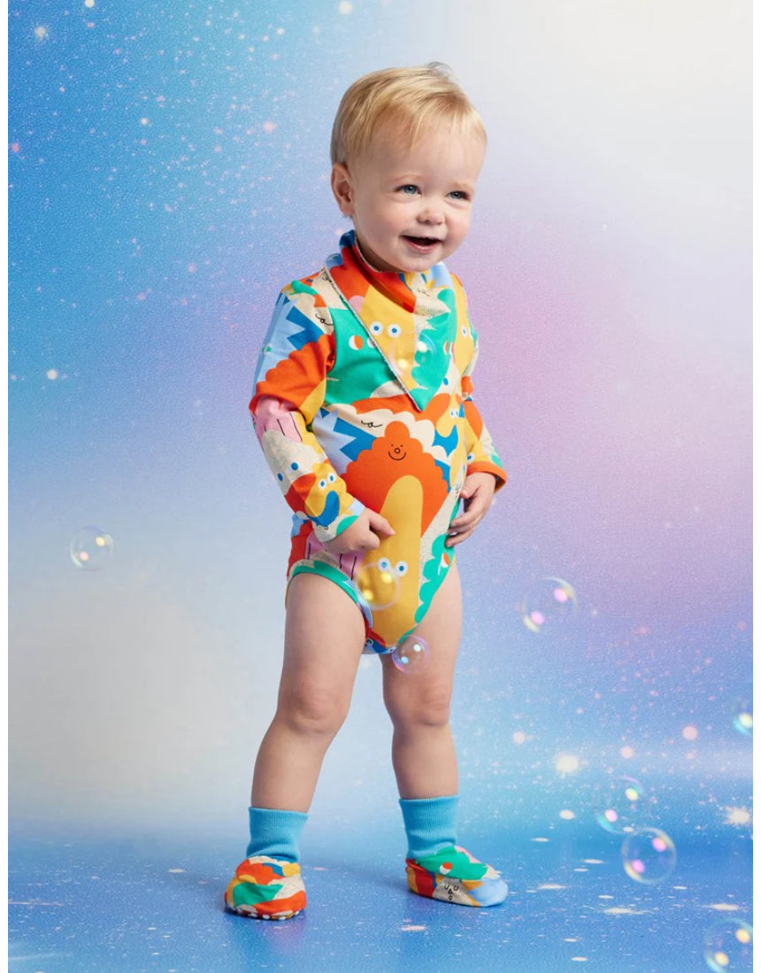 Halcyon Nights Mount Wiggly baby booties with colorful Wiggly character design, part of baby clothing set for infants.