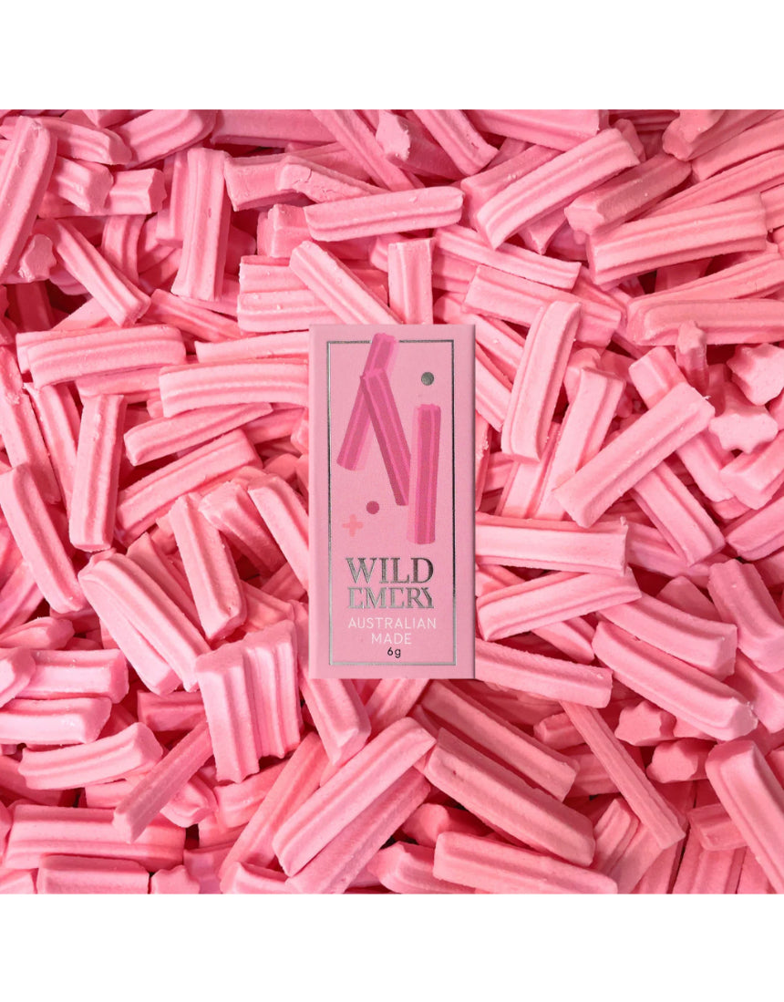 Wild Emery Musk Sticks Mini Lip Balm in a sleek lipstick tube with a natural musk scent.