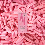 Wild Emery Musk Sticks Mini Lip Balm in a sleek lipstick tube with a natural musk scent.