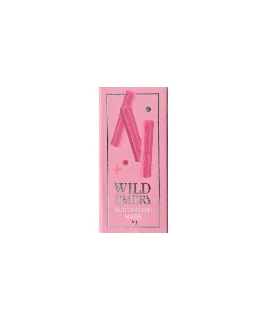 Wild Emery Musk Sticks Mini Lip Balm in a sleek lipstick tube with a smooth, natural finish.