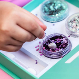 Kids Oh Flossy Under The Sea Glitter Set featuring colorful, glittery accessories for children styled with marine-themed designs.