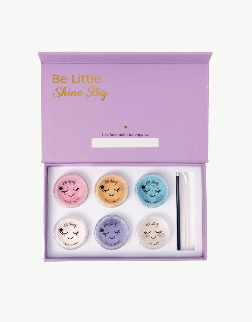Kids face paint set by Oh Flossy featuring colorful garden-themed face paint sticks and brushes for creative fun.