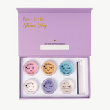 Kids face paint set by Oh Flossy featuring colorful garden-themed face paint sticks and brushes for creative fun.