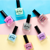 Kids' Oh Flossy nail polish in cream violet, featuring a colorful bottle with playful packaging and a brush applicator.