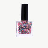 Kids nail polish by Oh Flossy in cream violet color, shown in a small bottle with a white cap and vibrant purple shade.