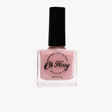 Kids' Oh Flossy nail polish in cream violet, featuring a bright, playful bottle with colorful design on the label.