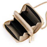 Olga Berg Elton mesh crossbody bag in gold with sleek design and adjustable strap, perfect for stylish everyday use.