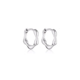 Linda Tahija Organica Mini Huggie Earrings in sterling silver, close-up of small, stylish hoop earrings on a white background.