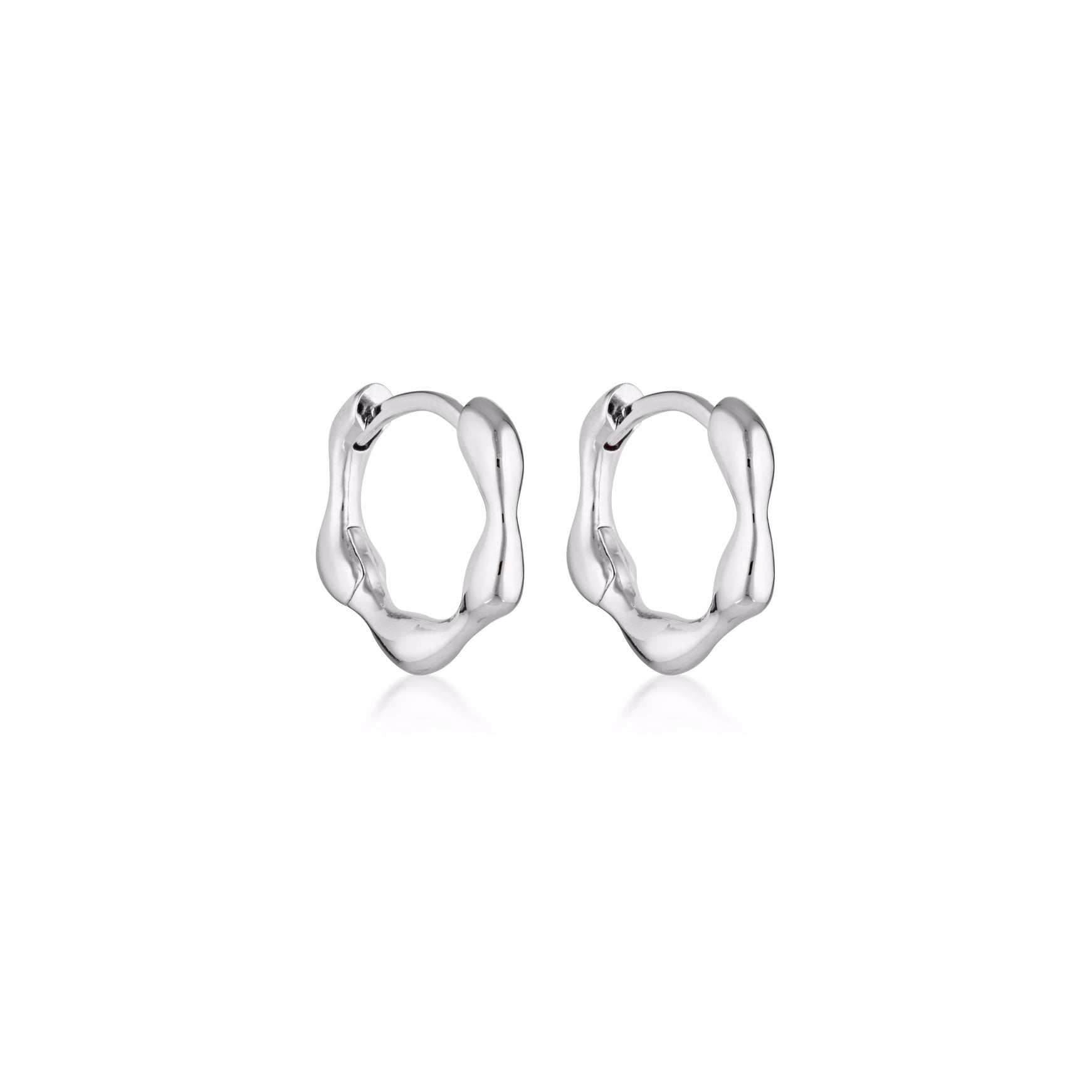 Linda Tahija Organica Mini Huggie Earrings in sterling silver, close-up of small, stylish hoop earrings on a white background.