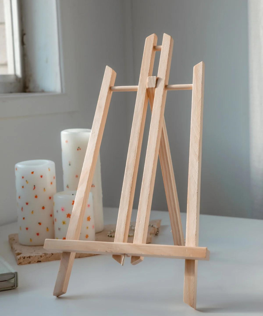 Paint Like Frida mini art easel with a paint by numbers canvas featuring a Frida Kahlo-inspired portrait displayed on the easel.