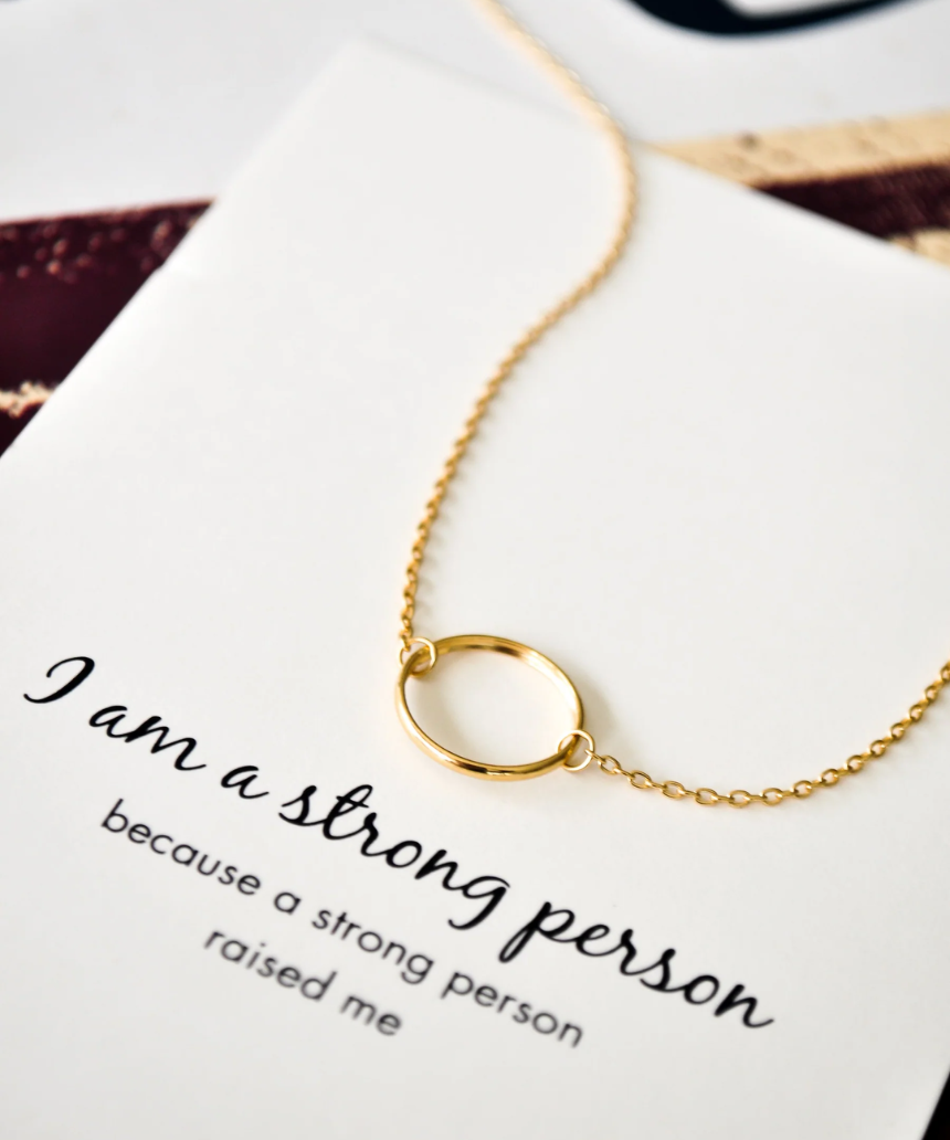 Silver and rose gold Petals Australia necklace with "I Am A Strong Person" pendant, elegant jewelry for empowered individuals.