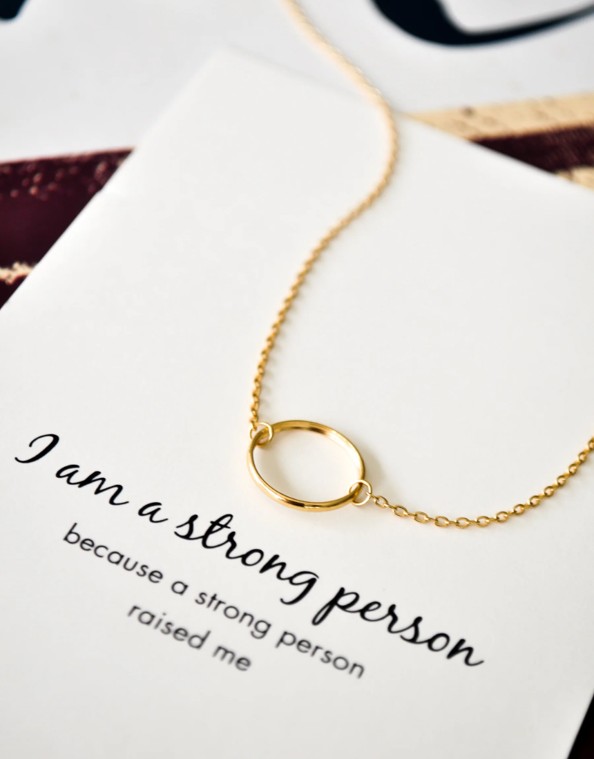 Silver and rose gold Petals Australia necklace with "I Am A Strong Person" pendant, elegant jewelry for empowered individuals.