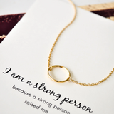 Silver and rose gold Petals Australia necklace with "I Am A Strong Person" pendant, elegant jewelry for empowered individuals.