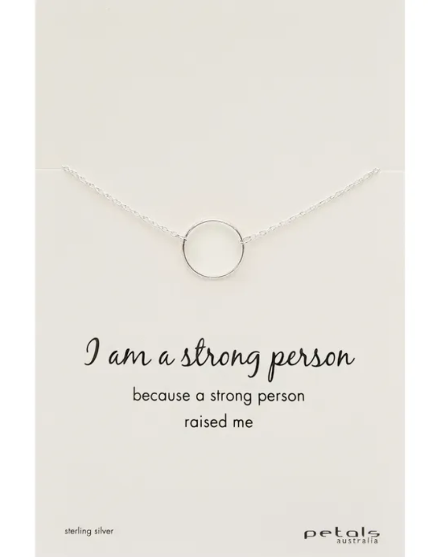 Petals Australia silver and rose gold necklace with a pendant engraved "I Am A Strong Person" for empowerment.