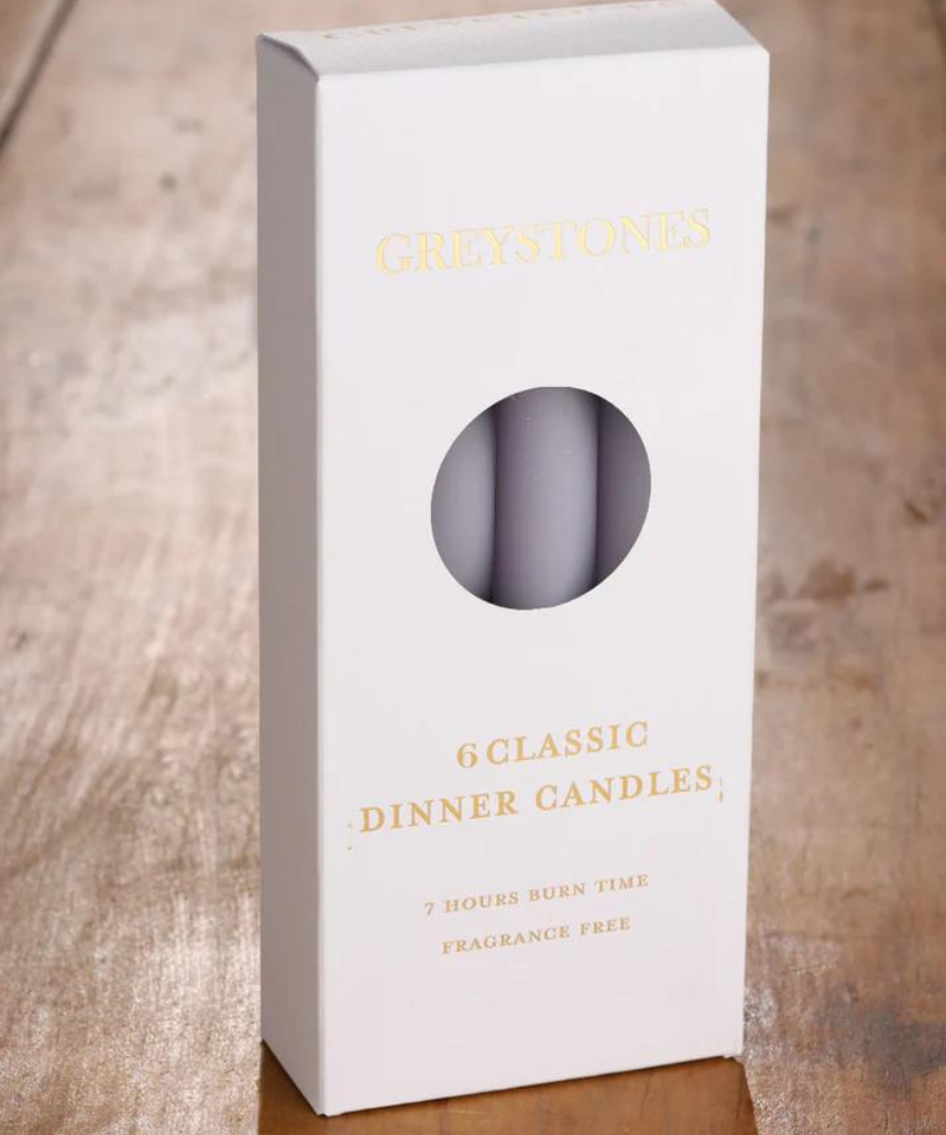 Six River Road Misty Moor dinner candles arranged in a pack, showcasing elegant white wax candles for dining or decor.