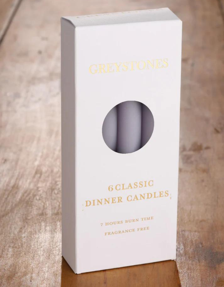 Six River Road Misty Moor dinner candles arranged in a pack, showcasing elegant white wax candles for dining or decor.