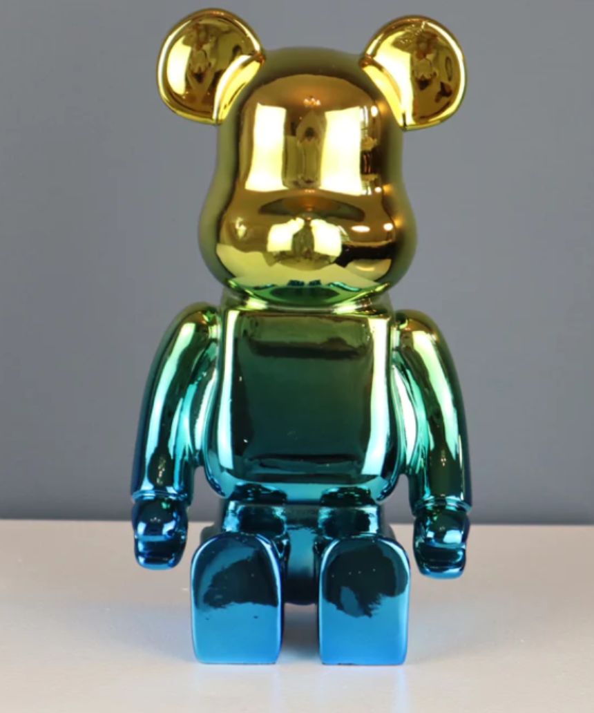 Roshi Chrome Bear sculpture with gold and blue accents, detailed metallic finish on a sleek modern design.