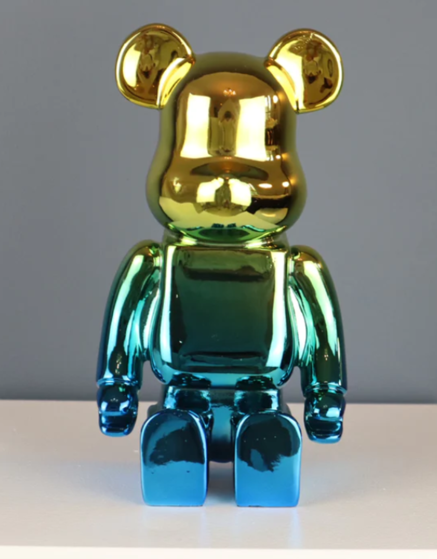 Roshi Chrome Bear sculpture with gold and blue accents, detailed metallic finish on a sleek modern design.