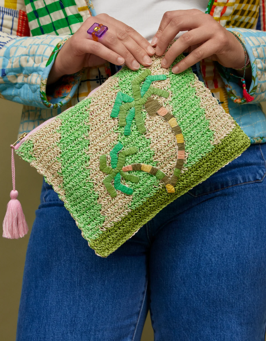 Sage x Clare San Carlos Rafia Clutch with woven texture and neutral tones, showcasing its stylish and handcrafted design.