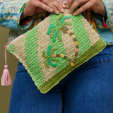 Sage x Clare San Carlos Rafia Clutch with woven texture and neutral tones, showcasing its stylish and handcrafted design.