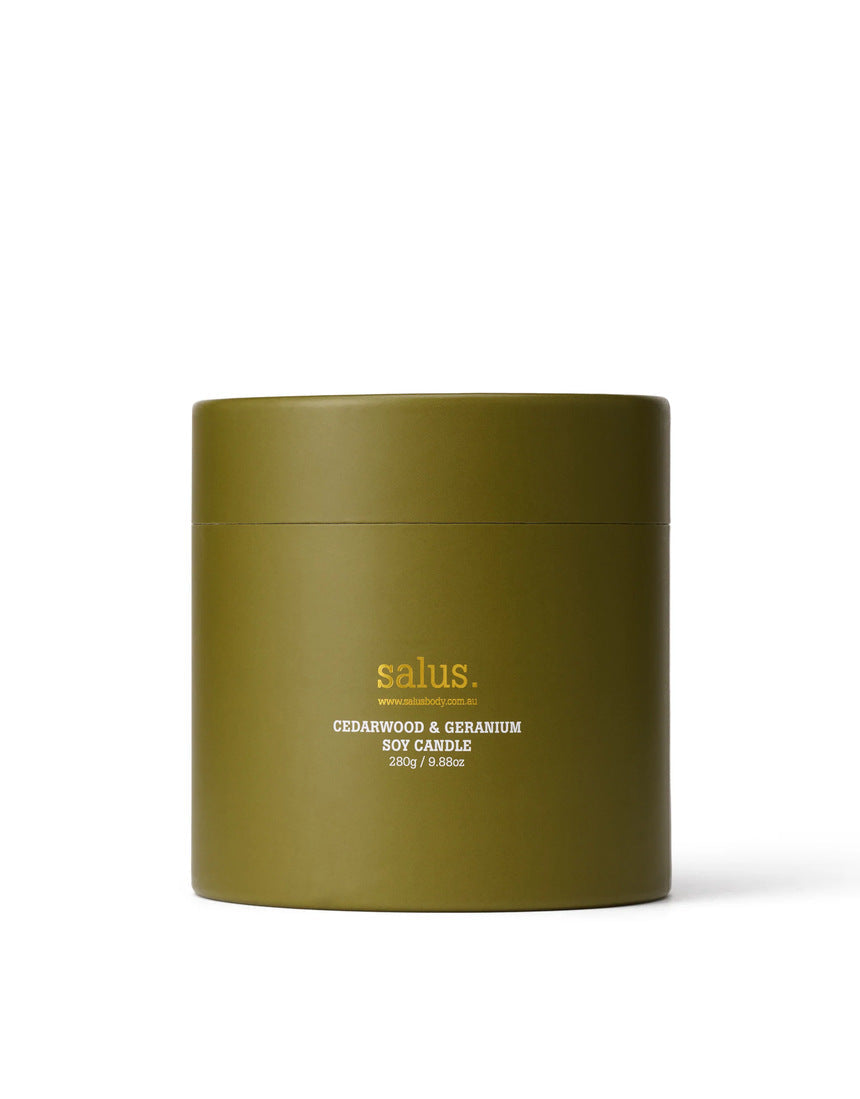 Salus Cedarwood and Geranium soy candle in elegant packaging with a natural, earthy design and brand logo visible.