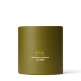 Salus Cedarwood and Geranium soy candle in elegant packaging with a natural, earthy design and brand logo visible.