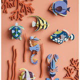 Studio Roof wall decor featuring a colorful lobster and various sea creatures in an artistic marine-themed illustration.