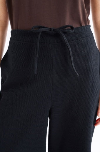 Black Elk Sanna Pant showing relaxed fit, high waist, and tapered leg style in soft fabric.