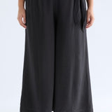 Black Elk Rema Pant shown on a model, featuring a relaxed fit with a comfortable waistband and tapered leg design.