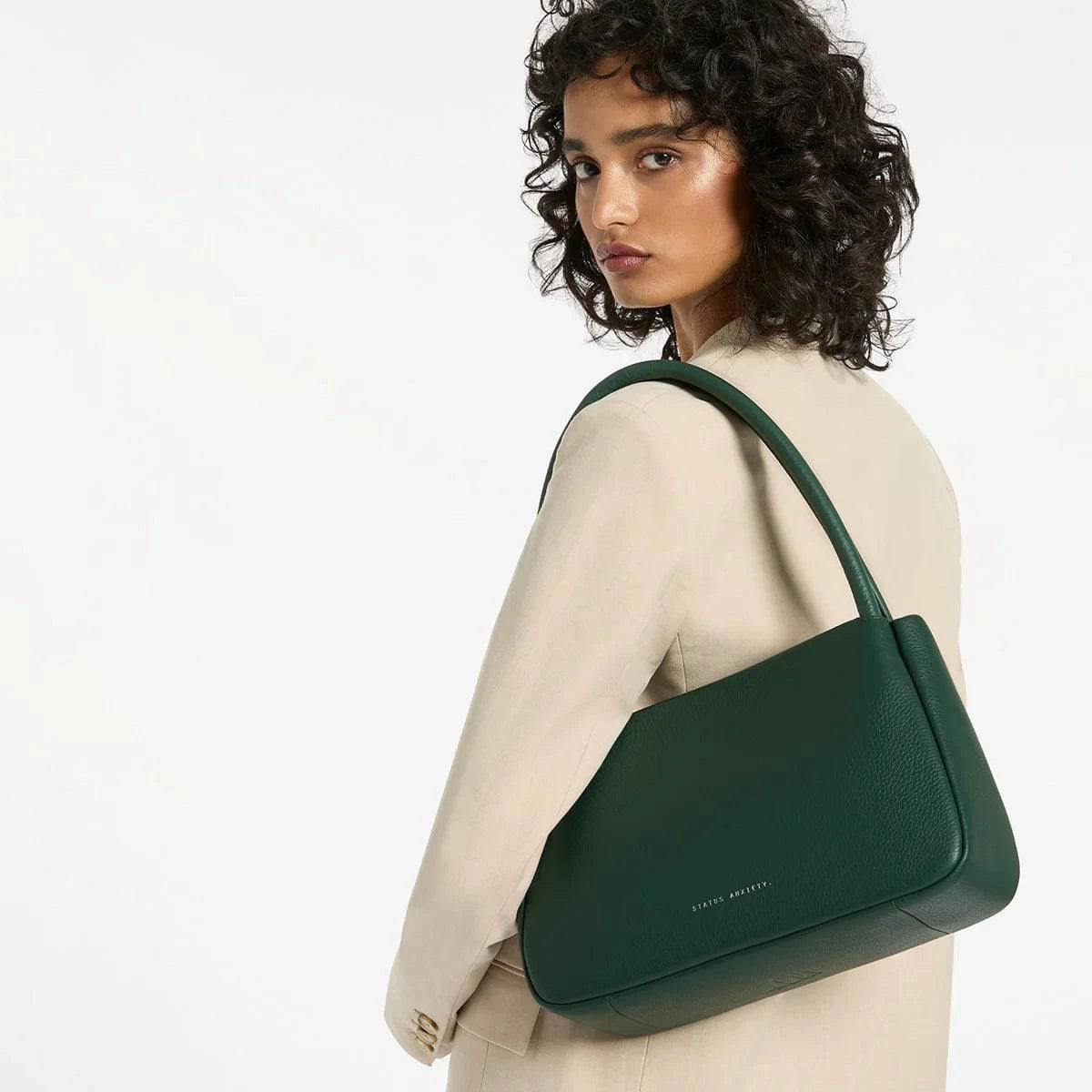 Green Status Anxiety Light Of Day handbag with stylish design, featuring a spacious interior and adjustable strap, perfect for everyday use.