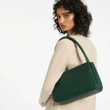 Green Status Anxiety Light Of Day handbag with stylish design, featuring a spacious interior and adjustable strap, perfect for everyday use.