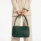Light of Day green handbag by Status Anxiety, stylish leather tote with top handles, casual everyday accessory.
