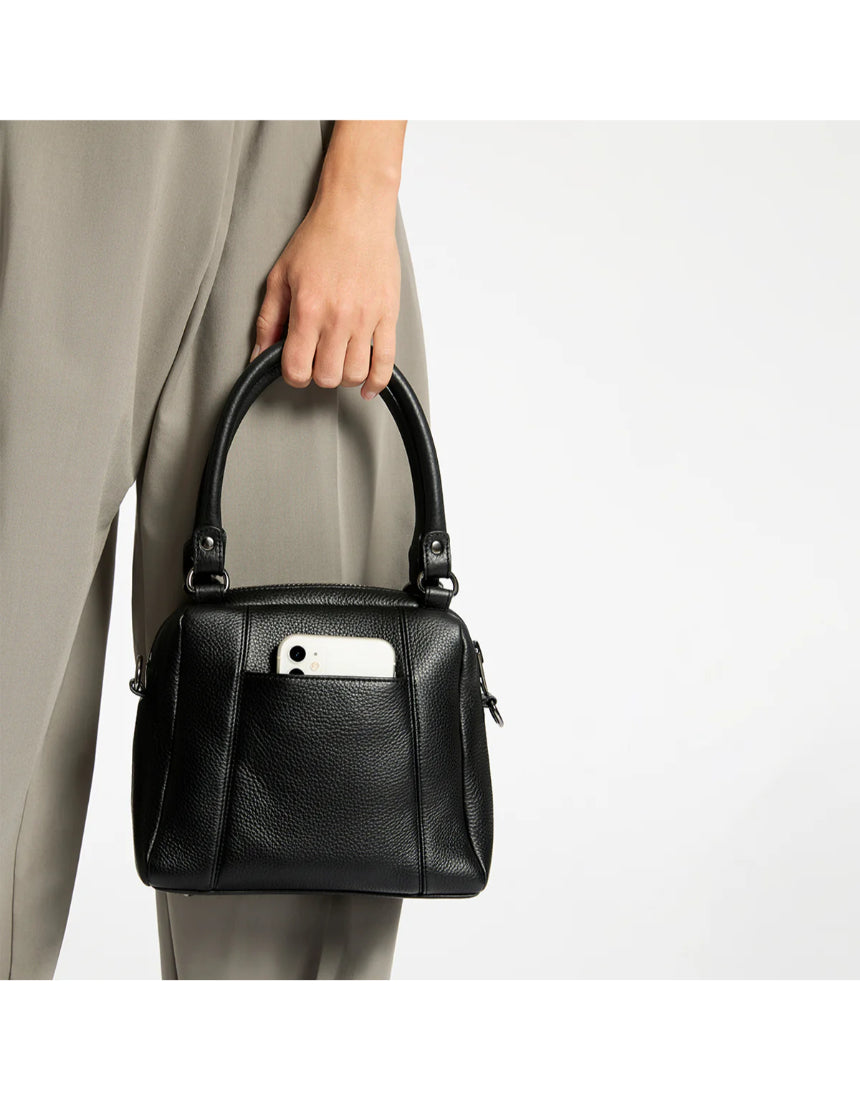 Black Status Anxiety Mini Mountains Bag featuring a compact design with leather accents, perfect for casual and everyday use.