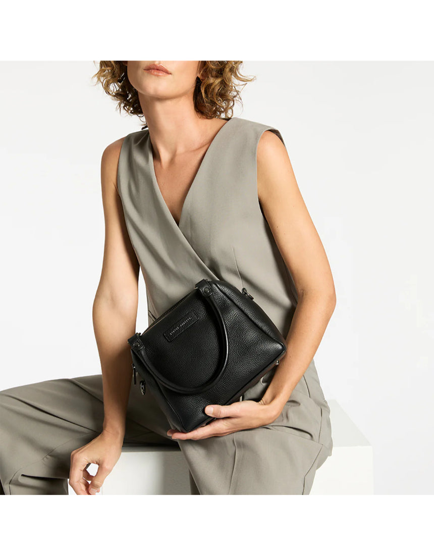 Black Status Anxiety Mini Mountains Bag with adjustable strap, featuring a compact, stylish design perfect for everyday use.